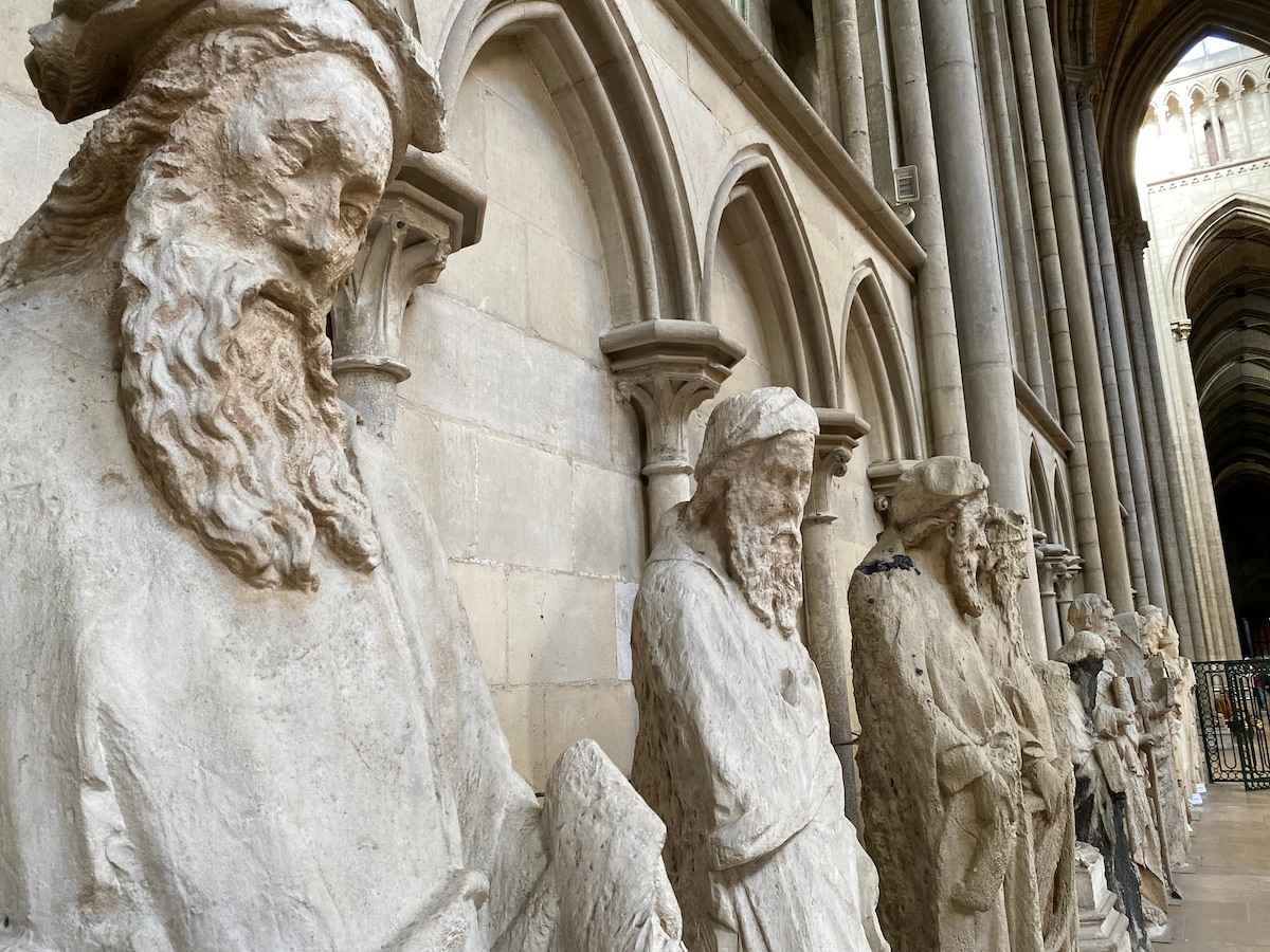 Row of carved figures of bearded saints.