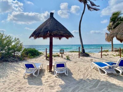 Private Sian Ka an resort with palapa and sand.