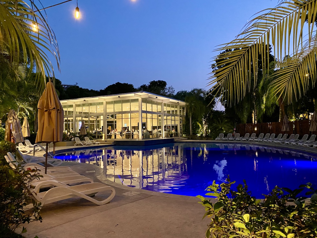 Alux restaurant and swimming pool in the evening.