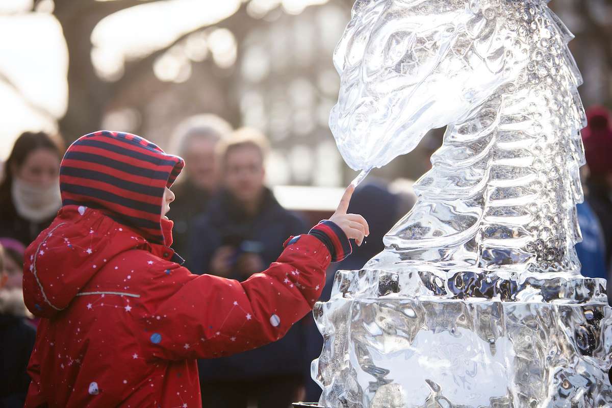 Person carving ice sculpture