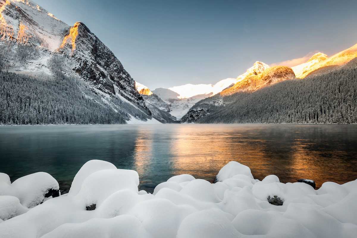 Lake Louise with ice with golden light.